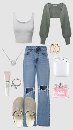 the contents of a woman's outfit including jeans, sweater and shoes are shown