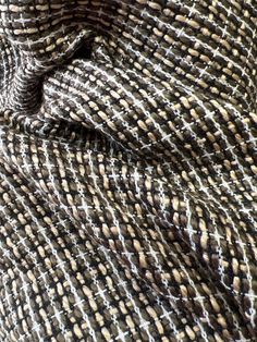 the fabric is woven with brown and white squares