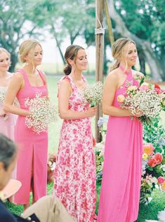 a group of women standing next to each other in front of a man and woman