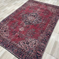 an antique persian rug is on the floor