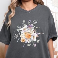 Our flower collage t-shirt is made with water color beautiful flowers. A perfect gift for the garden and flower lover. A nice choice for mothers day, bridal shower, perfect for all special occasion. Garment is made of 100% ring-spun cotton. The soft-washed, garment-dyed fabric brings extra coziness to your wardrobe while the relaxed fit makes it an excellent daily choice. Non-toxic, eco-friendly, water-based inks safer for you & the environment. Flower Collage, Women Flower, T Shirt Oversize, Comfort Colors Tee, Comfort Color, Flower Lover, Dyed Fabric, Blue Flowers, Flower Garden