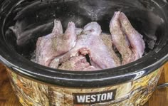 raw meat is being cooked in an electric pressure cooker