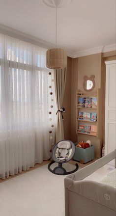 a baby's room is decorated in neutral colors