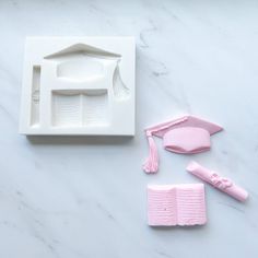 the tools needed to make a doll house are shown on a marble countertop, including pink toothbrushes and combs