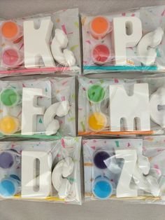 the letters are made out of plastic and have sprinkles on them,