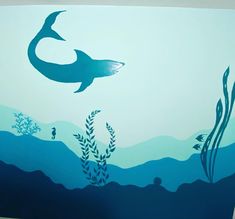 an underwater scene painted on the side of a wall