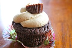 a chocolate cupcake with peanut butter on top