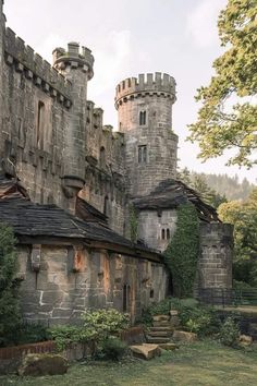 an old castle with stone walls and towers