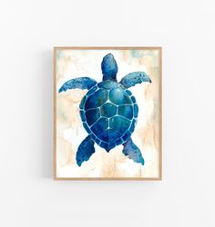 a painting of a sea turtle in watercolor on a white wall above a wooden frame