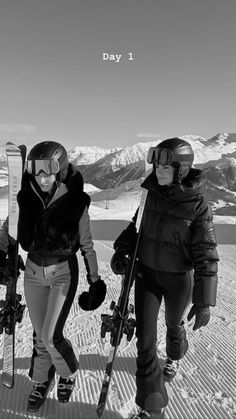 three skiers are walking in the snow with their skis on and one is wearing goggles