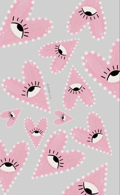 an image of pink and white flowers with black dots on the bottom, in front of a gray background