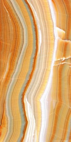 an orange, yellow and white marble textured with light blue streaks on the surface