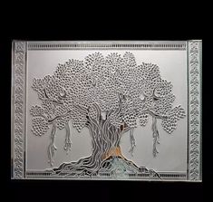 a metal plaque with an image of a tree on it