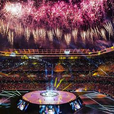 fireworks are lit up in the sky above a stadium