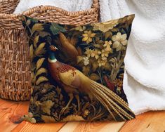 a decorative pillow sitting on top of a wooden floor next to a wicker basket