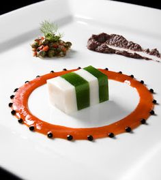 a white plate topped with food on top of a table