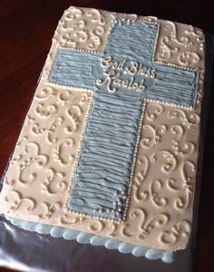 a cake decorated with blue and white icing that says god's help on it