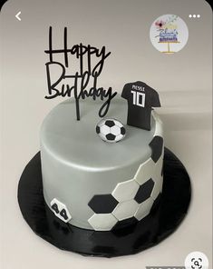 a soccer themed birthday cake with the number forty on it and a soccer ball in the middle