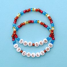 two beaded bracelets with words that spell out the word it's calm