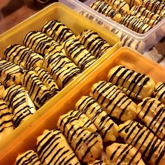 two trays filled with different kinds of pastries