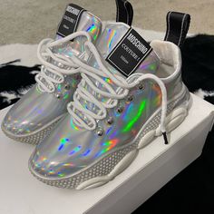 Moschino Iridescent Sneakers. Worn Once In Great Condition. Turn Heads With These Sneakers As The Iridescent Color Highlights Several Other Colors. Moschino Couture, Colored Highlights, Womens Shoes Sneakers, Moschino, Shoes Sneakers, Turn Ons, Women Shoes, Couture, Sneakers