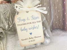 a baby shower tag sitting on top of a table