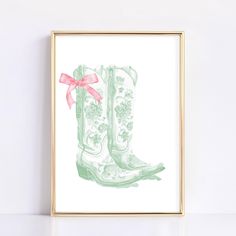 a watercolor painting of a pair of boots with a pink bow on the side