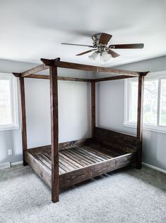 a canopy bed made out of wood with the words how to diy canopy bed