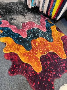 a colorful area rug is on the ground