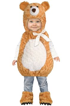 a little boy dressed in a teddy bear costume