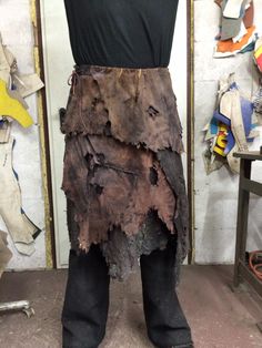 a mannequin made out of wood and leather