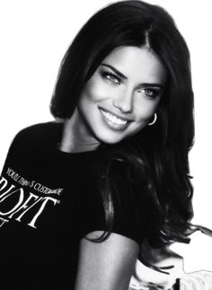 a black and white photo of a woman with long dark hair wearing a t - shirt