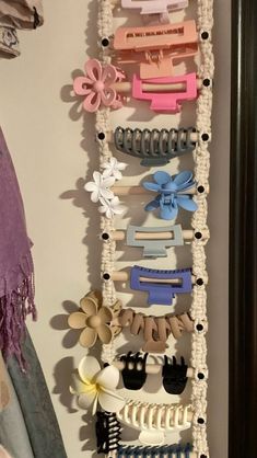 a bunch of hair clips hanging on a wall