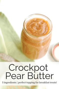 a close up of a jar of food on a table with text overlay that reads, crockpot pear butter 5 ingredients perfect topping for breakfast treats