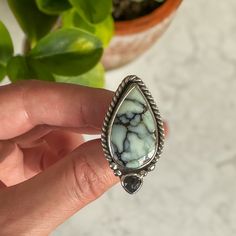 A beautiful, watery blue, large teardrop Aloe Variscite is wrapped in twisted wire. A small dark hued rosecut moss aquamarine accompanies it with small bubble embelishments. Sits on an split shank ring band. Entire Piece is made with sterling silver. Size 7.5 All of my work is hand crafted, from sourcing the stones from sustainable miners and lapidary artist, to forging the piece from sterling and fine silver sheet metal and wire. Over time, sterling silver develops a lovely patina, the more you wear this ring, the more it maintains its original shine. But if it starts to darken, a gentle polish with a soft jewelry cloth will bring it back to life. If you have any questions about this ring or any other pieces, feel free to reach out. Although I'm unable to accept returns or exchanges at th Soft Jewelry, Moss Aquamarine, Split Shank Ring, Aquamarine Ring, Wire Work Jewelry, Twisted Wire, Work Jewelry, Aquamarine Rings, Split Shank