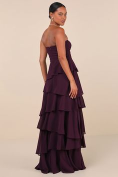 Your charm and the Lulus Gorgeous Essence Dark Purple Strapless Tiered Maxi Dress will make a flawless duo that'll keep everyone impressed all night long! Strut through the evening in effortless elegance with this lightweight woven chiffon gown that features a strapless, lightly gathered bodice (with hidden no-slip strips) and a sleek straight neckline. The high, banded waist sits atop a tiered, A-line skirt that falls to a sweeping maxi hem. Hidden back zipper/clasp. Fit: This garment fits true Dark Formal Dresses, Prom Dresses Dark Purple, Conformation Ideas, Deep Purple Prom Dress, Plum Prom Dress, Deep Purple Bridesmaid Dresses, Dark Purple Prom Dress, Dark Purple Dress, Tiered Gown