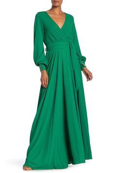 Partially lined for comfort, this maxi dress showcases a V-neckline with a cross-front design, long bell sleeves with button cuffs, an elasticized waist with a side belt and a flowing skirt. 56" length (size Small) Surplice V-neck Long sleeves Attached waist tie Partially lined 100% polyester with 100% rayon lining Dry clean Imported Daytime Dresses, Flowy Maxi Dress, Dress Sewing Pattern, Bridesmaid Gown, Sweaters And Leggings, Maxi Wrap Dress, Formal Evening Dresses, Midi Dress Bodycon, Mother Of The Bride Dresses