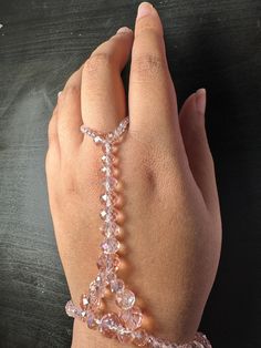 Hi! Welcome to my glass crystal wrist to ring bracelet!  Gift for yourself or a friend to match with any outfit! Perfect for every day wear!  The bracelet is made out of stretchy string that can be double layered for sturdiness.  The beads themselves are faceted Glass Beads that are wrapped around the wrist and up the top of the hand to the middle ring finger..  Sizes are small medium and large, respectively 7 inches,7.5 and 8 inch diameter.  Please message me for any questions I will respond im Waist Beads African, Crystal Princess, Diy Slippers, Hand Chain Bracelet, Diy Bracelet Designs, Waist Beads, Hand Bracelet, Bead Bangles, Hand Chain