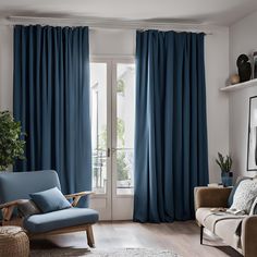 a living room filled with furniture and blue curtains