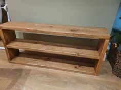 a wooden shelf sitting on top of a hard wood floor