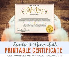 the santa's nice list printable certificate is on display in front of a wooden table