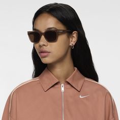 Show up in Nike fashion with throwback flair. The Nike Crescent II sunglasses are built from 20% recycled content by weight with a vintage aesthetic that’s chunky and sleek, combining timeless design with modern sensibilities. It features slightly angled cat-eye lenses with minimalist logos at each temple etched in bespoke, silver-tone hardware. Modern Sunglasses With Gradient Lenses For Fall, Casual Sunglasses With Gradient Lenses For Streetwear, Casual Tinted Sunglasses For Streetwear, Casual Tinted Lenses Sunglasses For Streetwear, Casual Brown Cat Eye Sunglasses With Gradient Lenses, Brown Cat Eye Sunglasses With Gradient Lenses, Modern Tinted Sunglasses For Fall, Modern Tinted Lenses Sunglasses For Fall, Casual Cat Eye Sunglasses With Polarized Square Lenses