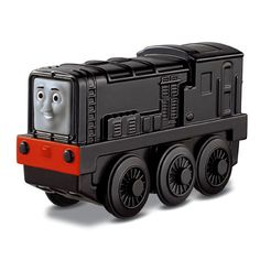 a black and red toy train with a smiling face on it's front engine