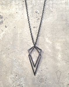 Here is the original Uneven pendant's little sister, the small Uneven pendant. Handcrafted in Sterling silver with a beautiful geometric look that will fit any outfit. Unisex necklace that is dainty and beautiful on its own but also looks fierce layered with others. Sharp lines, subtle witchy look,paired with a 18 inches 2mm sterling silver chain, it is the more delicate version of our big Uneven pendant. Size: app. 45mm height x 20 mm width Chain length: (18 inches) *Contact me if you would lik Minimalist Gunmetal Necklace For Gift, Nickel-free Edgy Necklace Gift, Edgy Nickel-free Necklace For Gift, Goth Pendant, Pendulum Necklace, Minimal Pendant, Silver Clay, Witchy Jewelry, Unisex Necklace