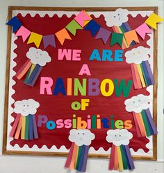 we are a rainbow of possibilities bulletin board with paper clouds and rainbows on it