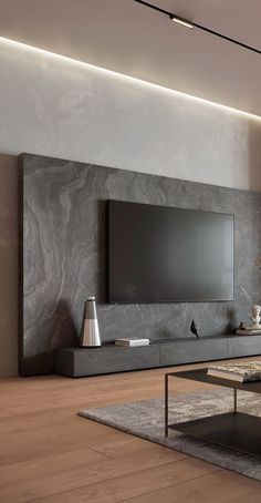 a living room with a large flat screen tv mounted on the side of it's wall