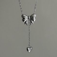 "Bow Drop Heart Necklace  ✨ Fully stainless steel & tarnish proof! (18k gold plated/stainless steel) 15.5\" with a 2\" extender  oval link chain style featuring a unique mini puffed bow pendant & mini heart pendant 🤍 choose between silver or gold at checkout 😊 Handmade with love!" Cute Silver Necklaces, Gift Bow Pendant Jewelry, Silver Sterling Silver Necklace With Bow, Elegant Sterling Silver Necklace With Bow, Silver Bow Necklace, Elegant Bow Pendant Necklace, K Jewelry, Silver Heart Jewelry, Silver And Gold Jewelry