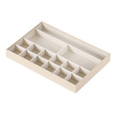 an empty tray with compartments for various items