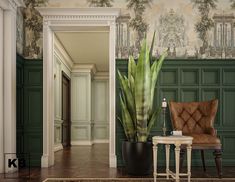 a chair sitting in front of a green wall with a large potted plant next to it