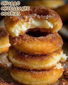 there are three donuts stacked on top of each other with cheesecake toppings